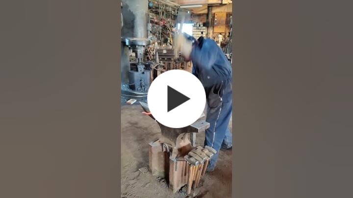 Christopher Thomson forging wrought iron fireplace tools.